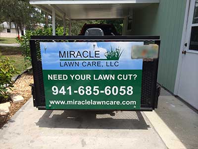 miracle-lawn care north port trailer sign